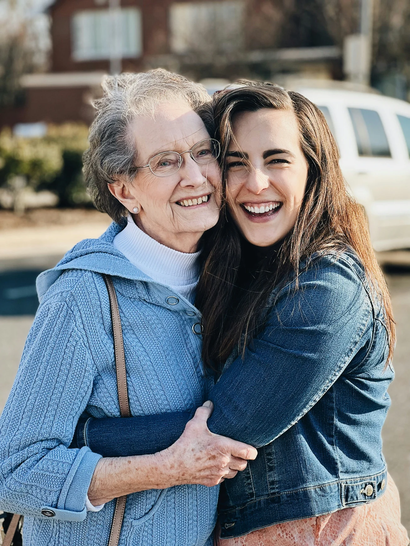 Two generations of a family smiling together.