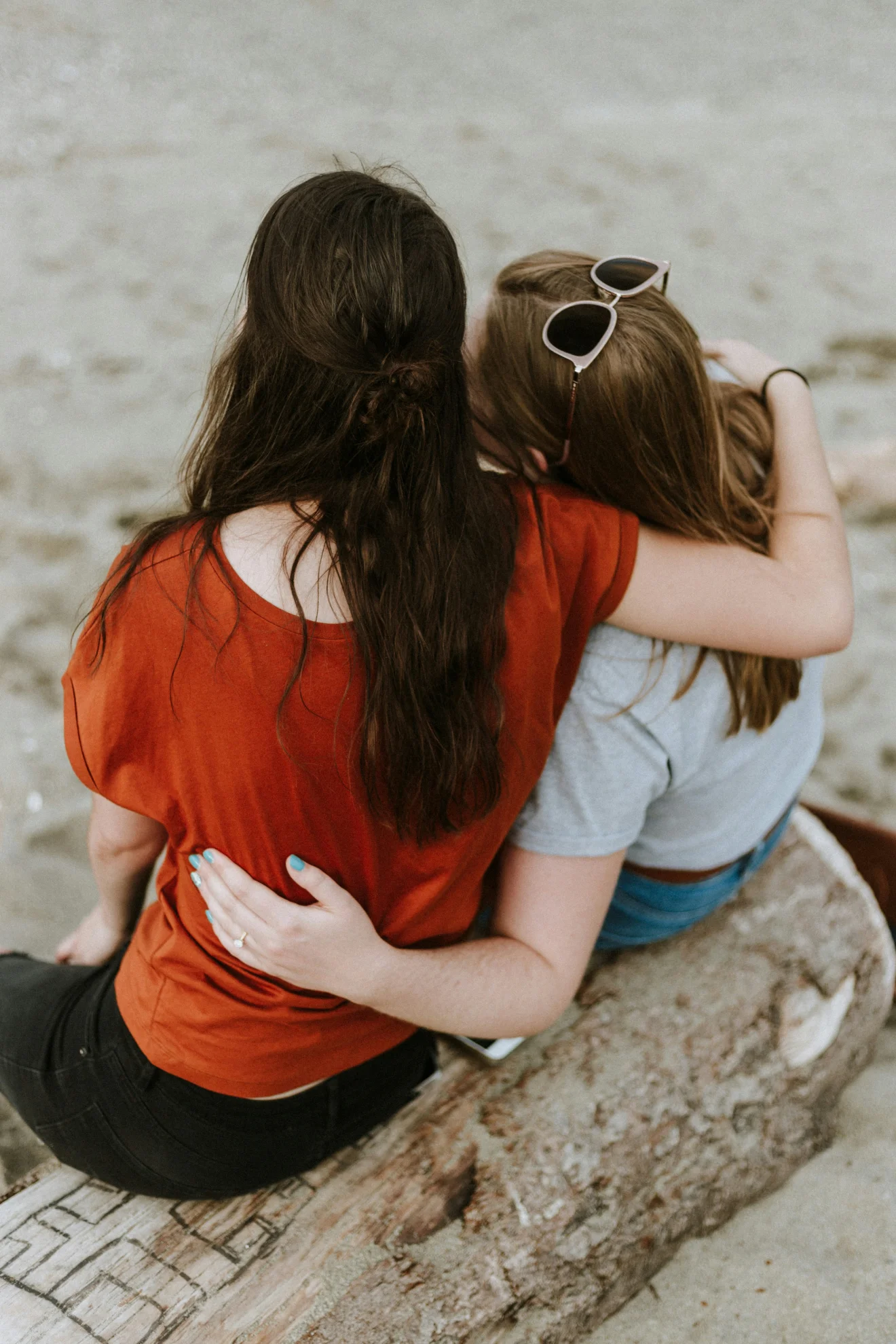 Friends sitting together outdoors.